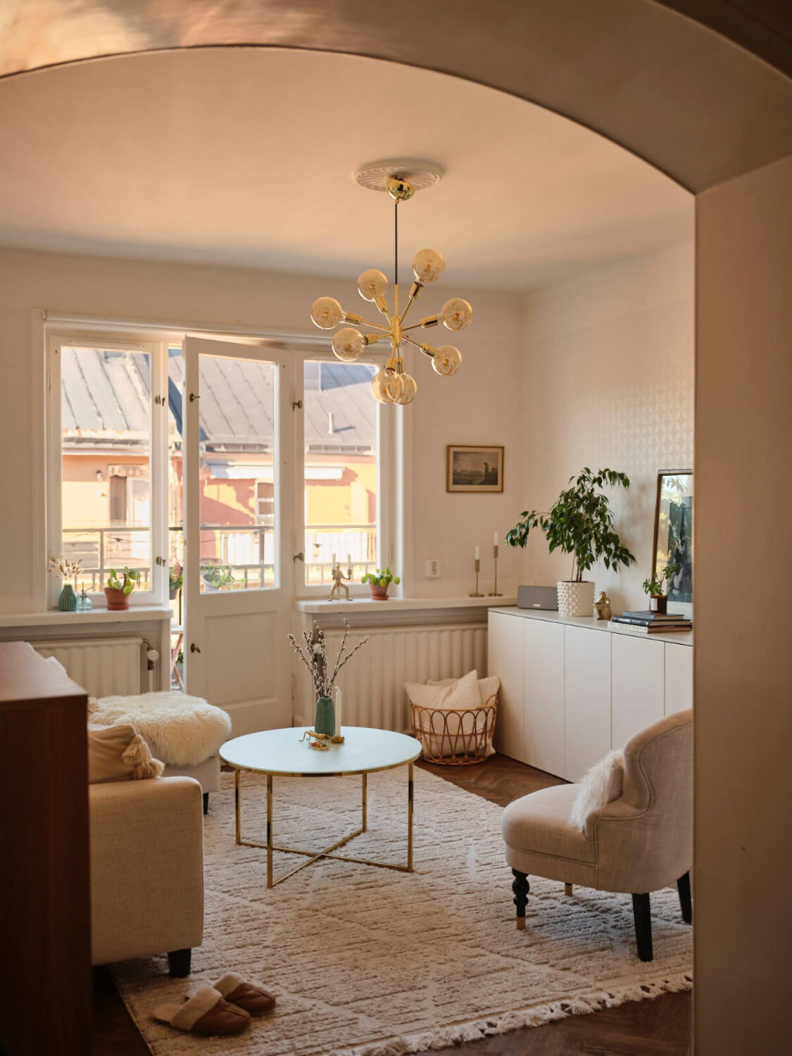 A Light-Filled 1920s Apartment with Two Spacious Balconies 1 arched doorway living room