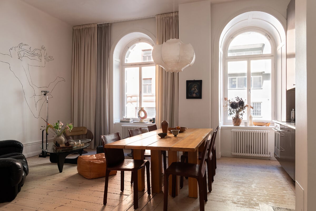 Arches and a Wall Mural in a Swedish Apartment 1 arched windows line art mural open-plan living space