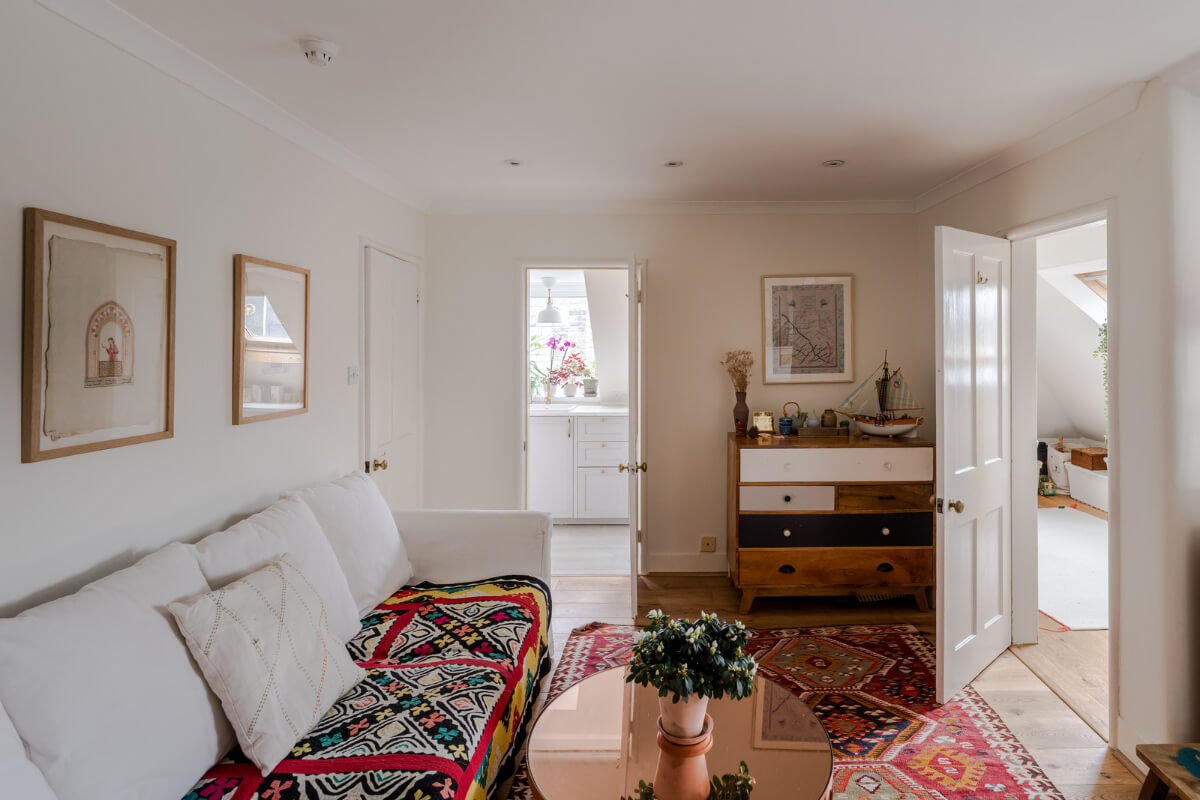A Light-Filled London Attic Apartment with Cozy Nooks 13 attic apartment living room colorful textiles
