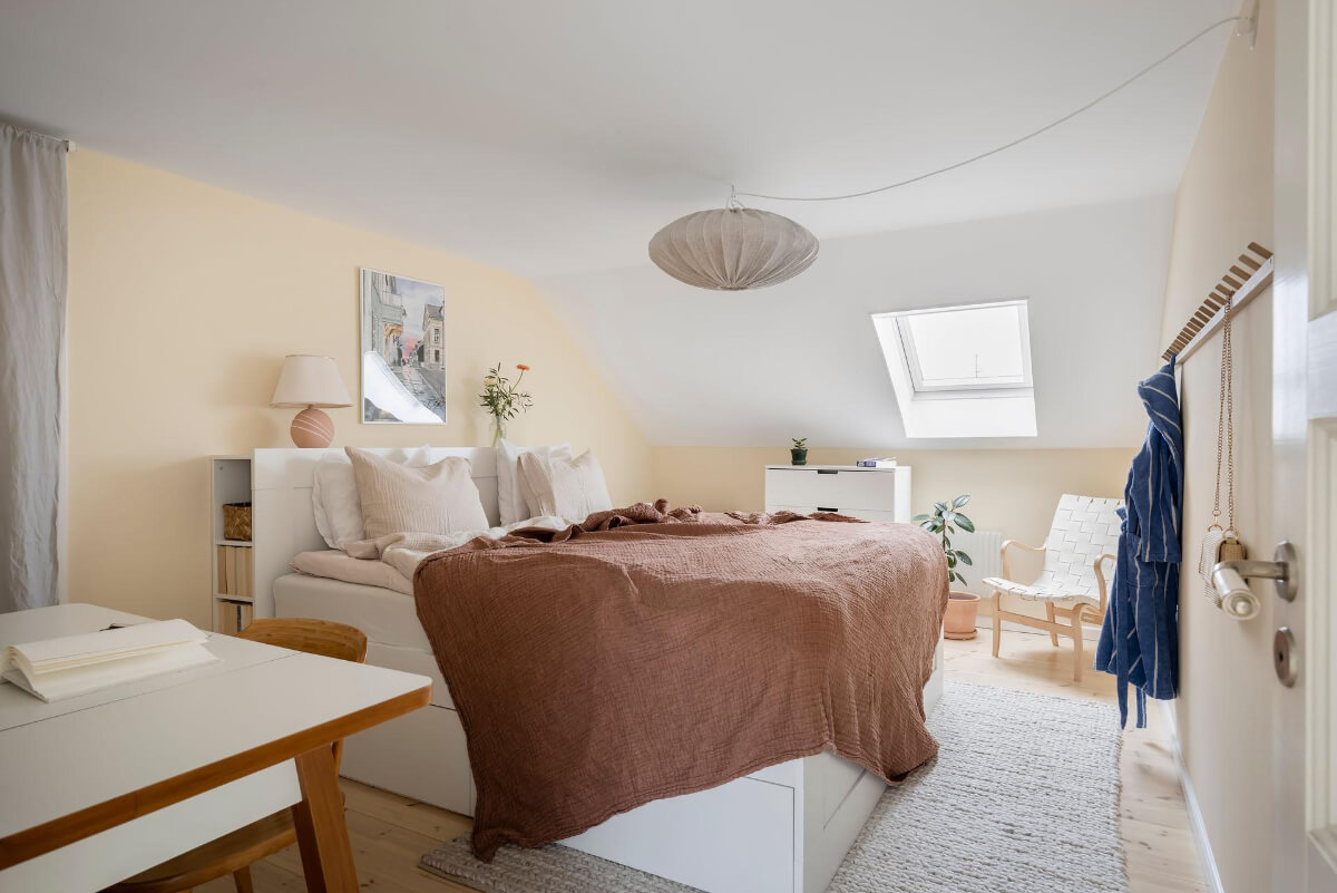 Timeless Charm and Contemporary Design in a 1930s Duplex Apartment 23 attic bedroom light yellow walls
