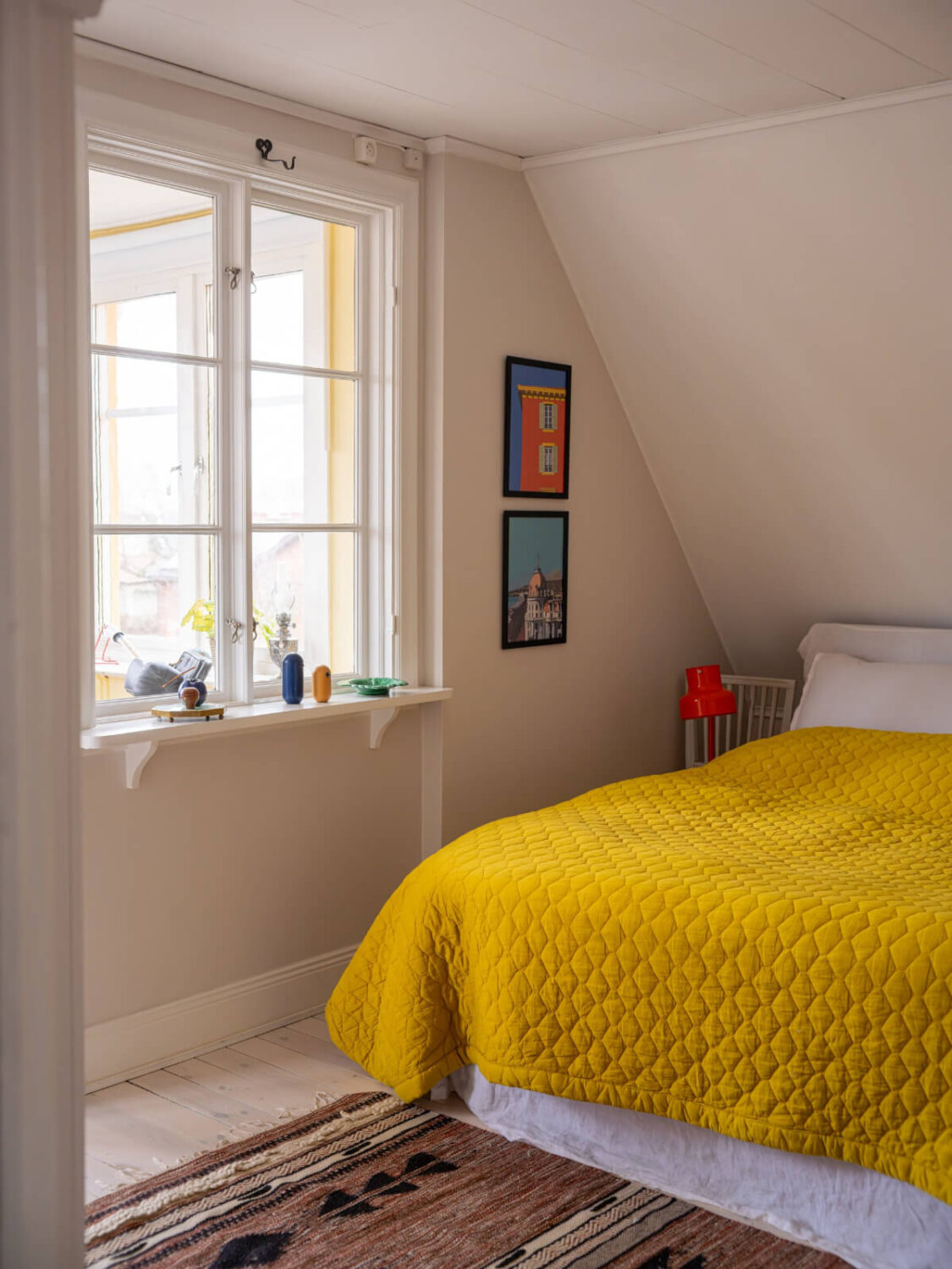A Beautiful Renovated Family Home with a Charming Garden 24 attic bedroom yellow bedspread