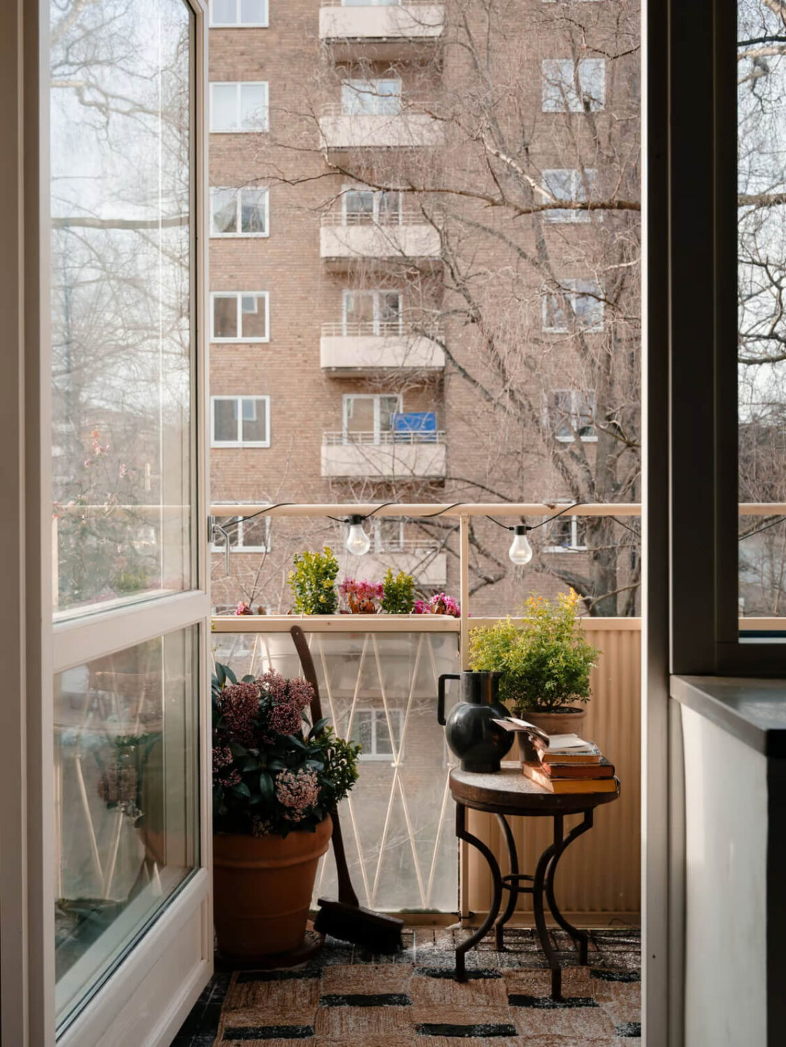 Limewash Walls in Muted Tones in a Swedish Apartment 13 balcony