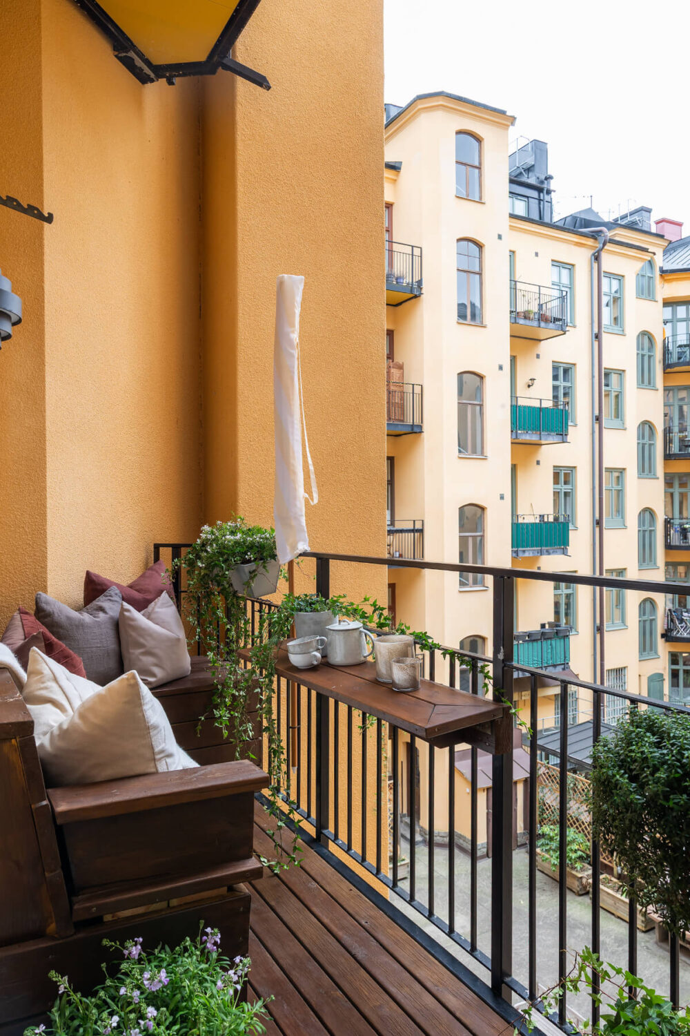 A Luxurious Stockholm Apartment with Period Features and a Blue Fireplace 21 balcony with small table