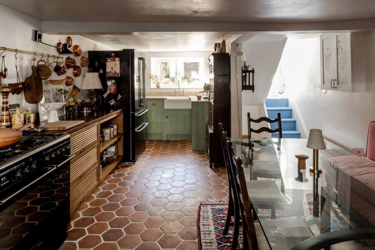 Color, Pattern, and Textures in a Renovated London Townhouse 9 basement kitchen with terracotta hexagon tiles and wood and green cabinets nordroom