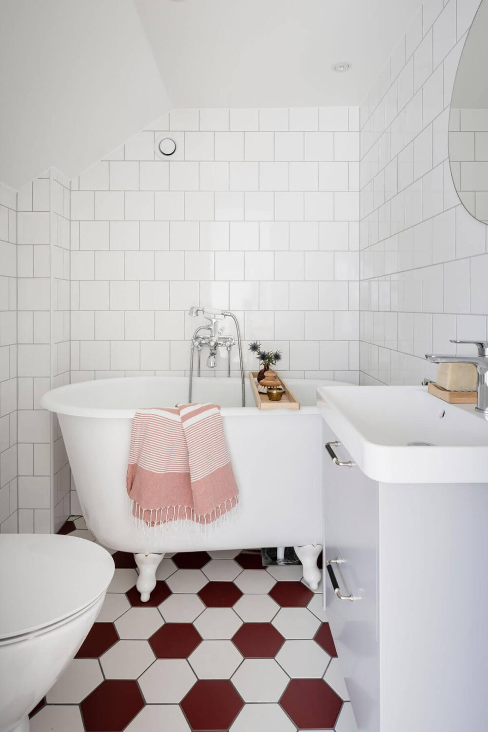 Timeless Charm and Contemporary Design in a 1930s Duplex Apartment 30 bathroom red and white hexagon floor tiles freestanding bath