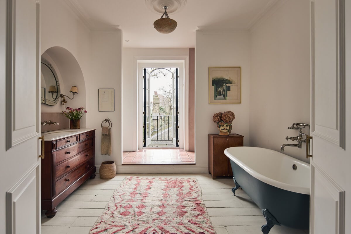 An Early Victorian House with a Unique Barrel-Vaulted Artist's Studio 15 bathroom wooden floorboards clawfoot bath arched niche for vanity sink