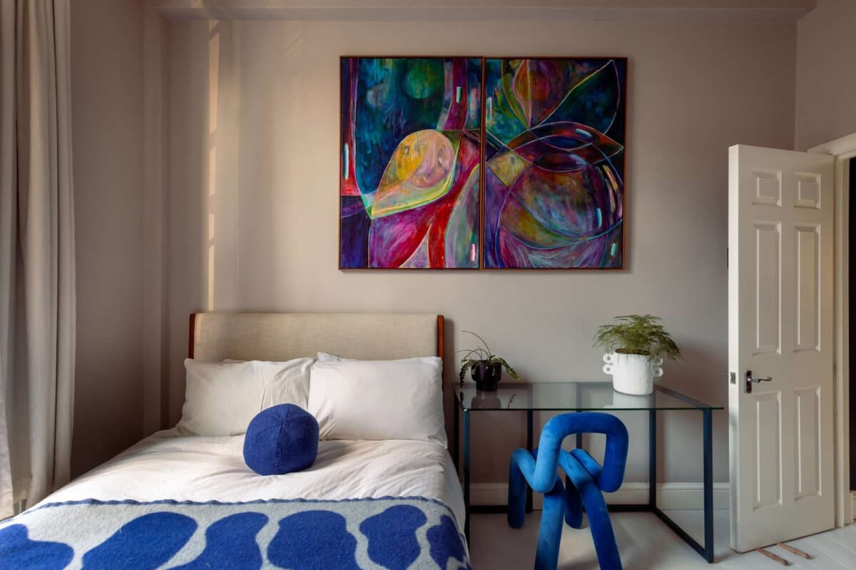 A Corner Apartment with Large Windows in a Former London Pub 14 bedroom blue color accents clear desk