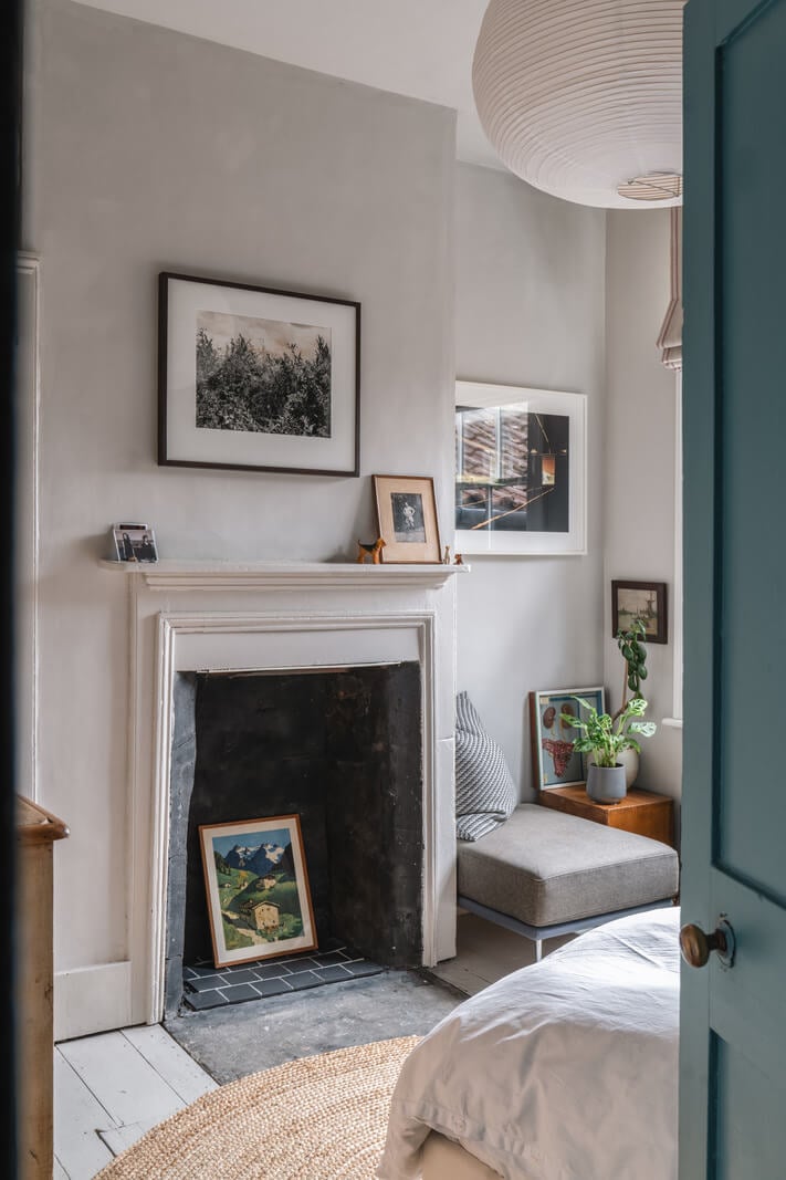 A Cozy Victorian Home Painted in Moody Blue and Gray Tones 22 bedroom fireplace