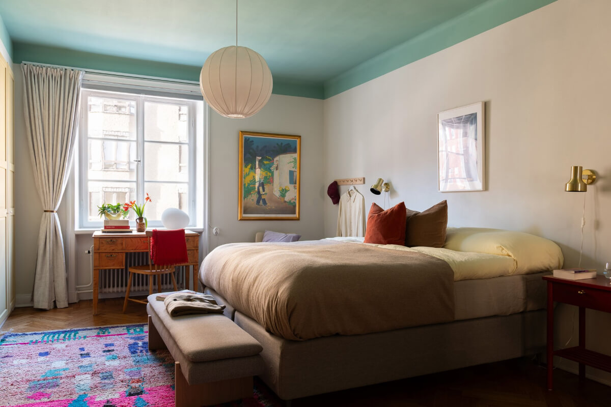 A Swedish Apartment with Period Features and Charming Color Pops 20 bedroom green painted ceiling