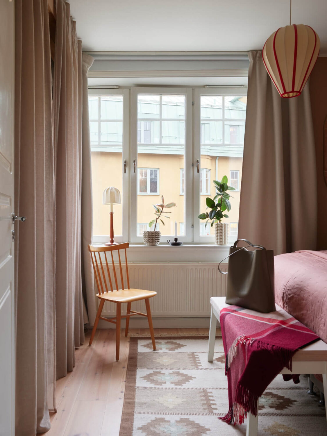 A Green Kitchen and a Pink Bedroom in a Charming Apartment 13 bedroom wardrobes behind curtains