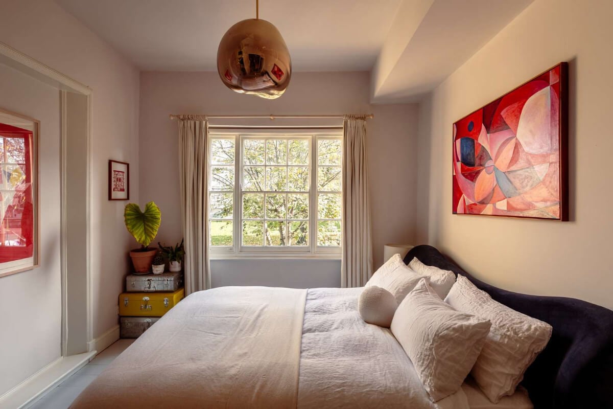 A Corner Apartment with Large Windows in a Former London Pub 11 bedroom wavy blue velvet headboard