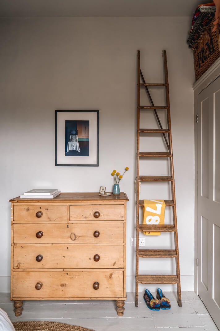 A Cozy Victorian Home Painted in Moody Blue and Gray Tones 25 bedroom wooden dresser