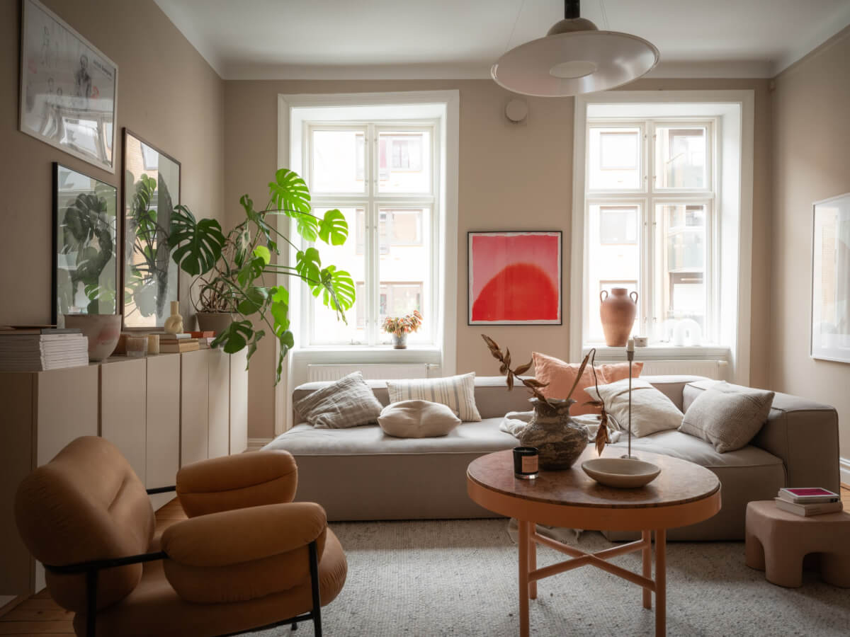 A Calm Color Palette in a Charming Swedish Apartment 3 beige living room large windows