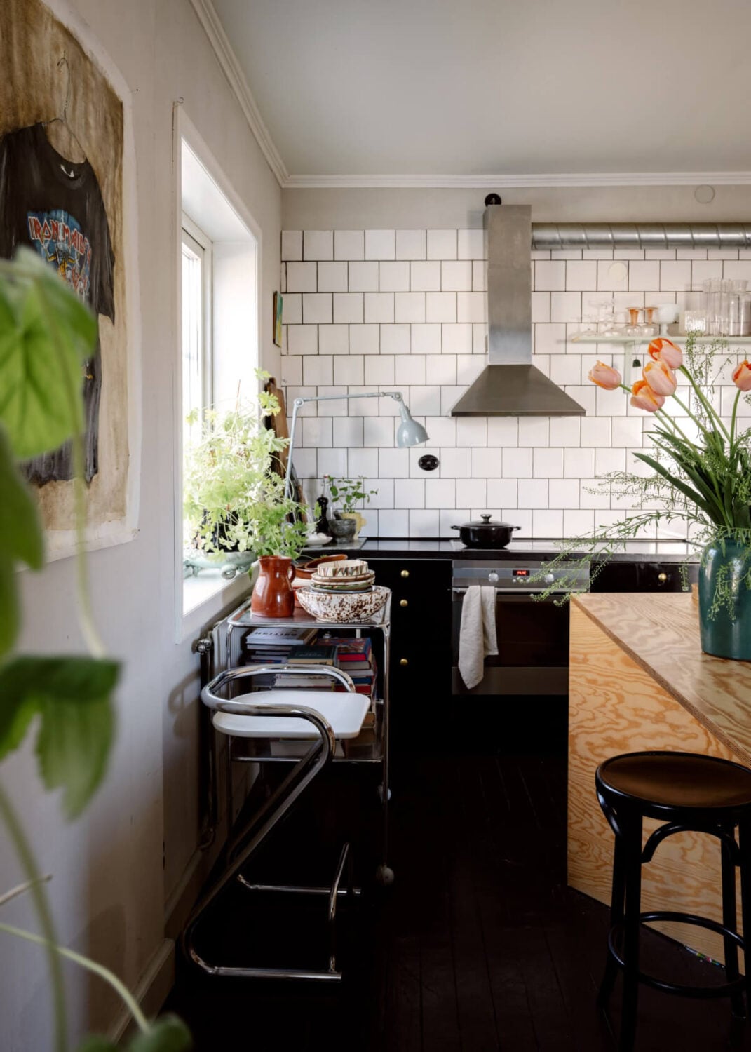 An Amazing Swedish House with Pink and Gray Rooms 12 black and white kitchen plywood island