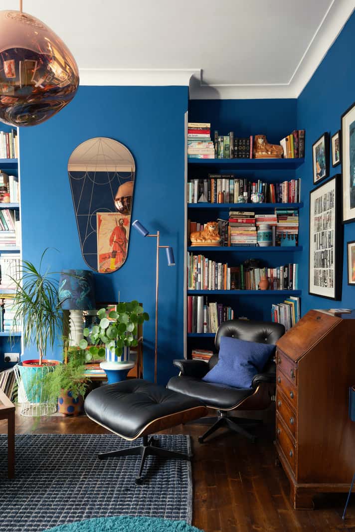 A Colorful Home with a Gold Extension in North London 12 blue living room with bookshelves