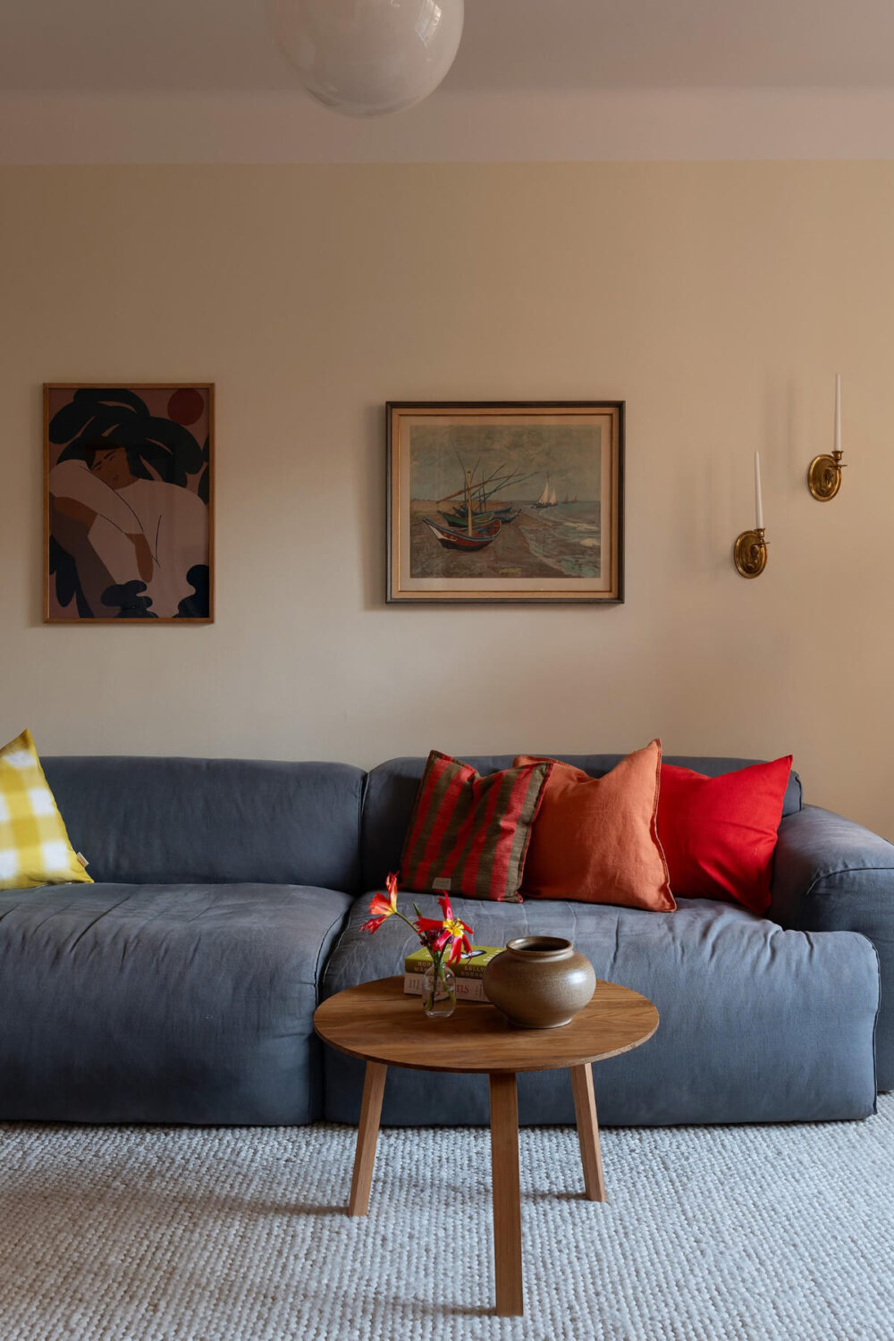 A Swedish Apartment with Period Features and Charming Color Pops 3 blue sofa