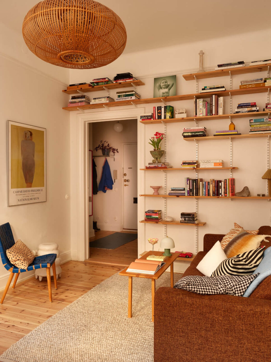 Revisiting a Bright Scandi Apartment with a Gray Kitchen 6 bookshelves