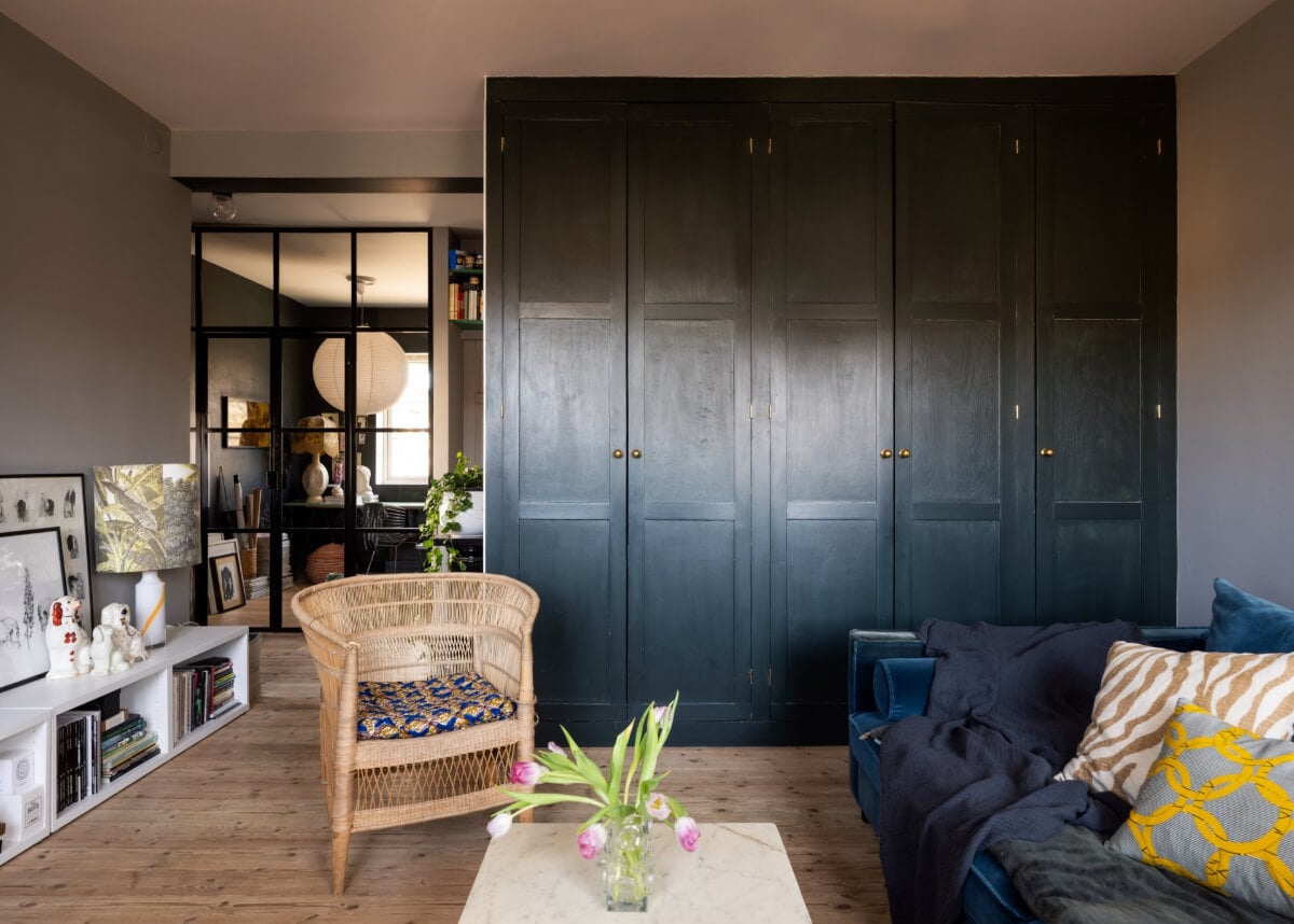 An Amazing Swedish House with Pink and Gray Rooms 22 built-in cabinets sitting room gray walls wooden floor