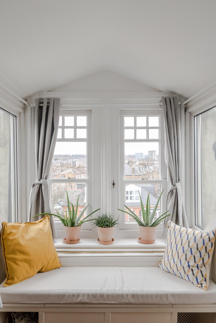 A Light-Filled London Attic Apartment with Cozy Nooks 18 built-in window seat