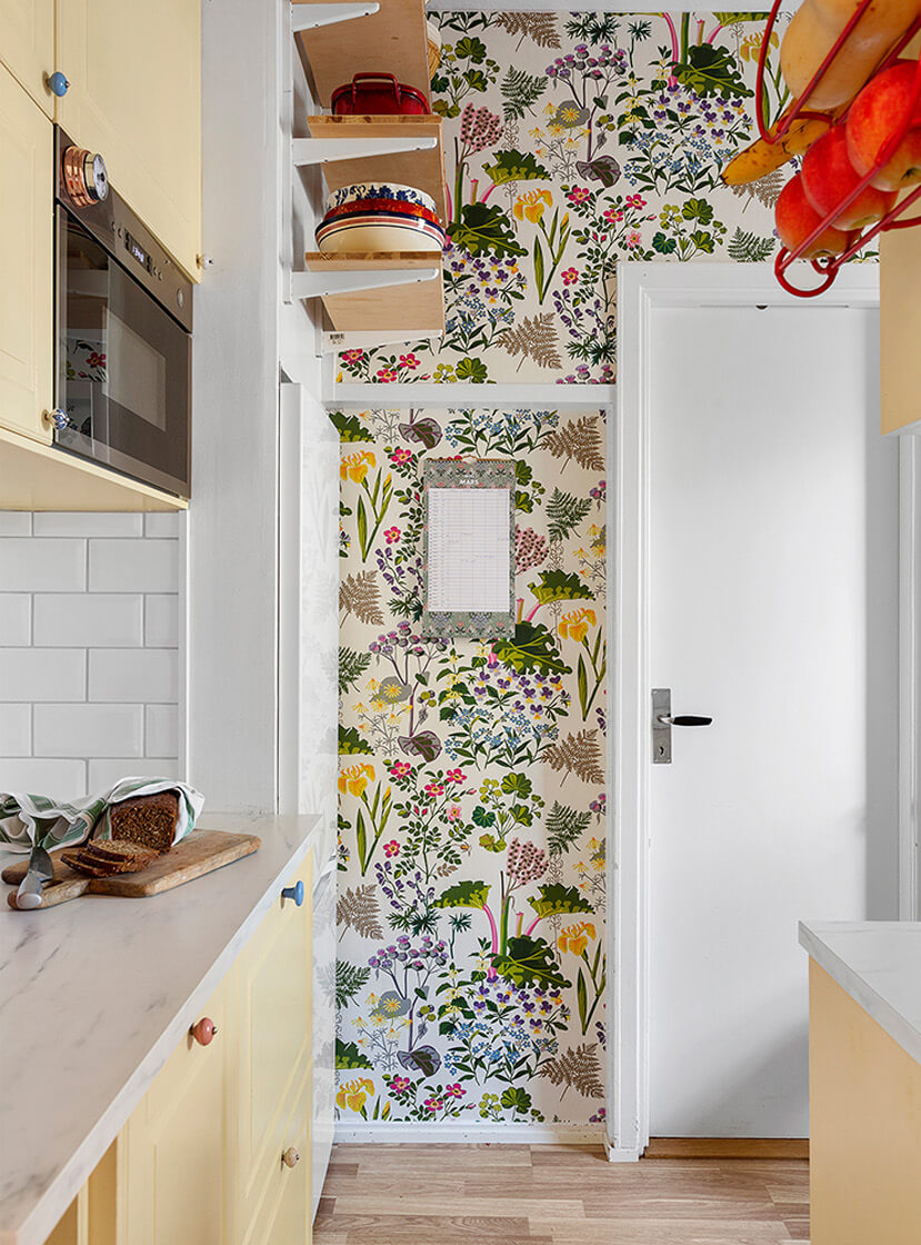 A Colorful 1940s Apartment in Stockholm 5 butter yellow kitchen floral wallpaper