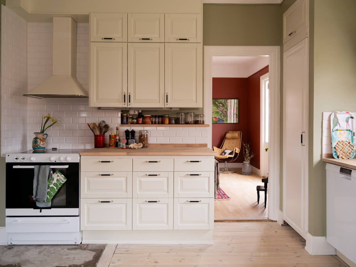 A Beautiful Renovated Family Home with a Charming Garden 11 classic kitchen white tiles green walls