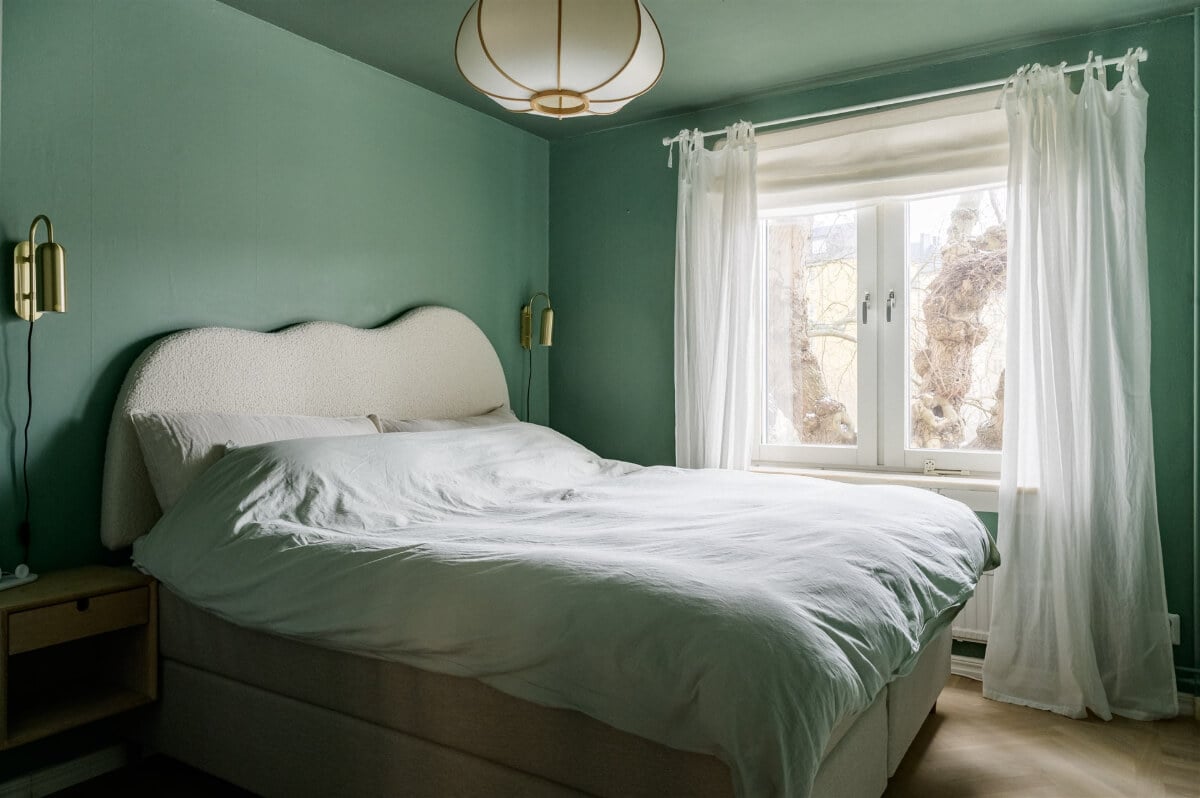Colorful Rooms in a Bright Two-Bedroom Stockholm Apartment 15 color drenched green bedroom