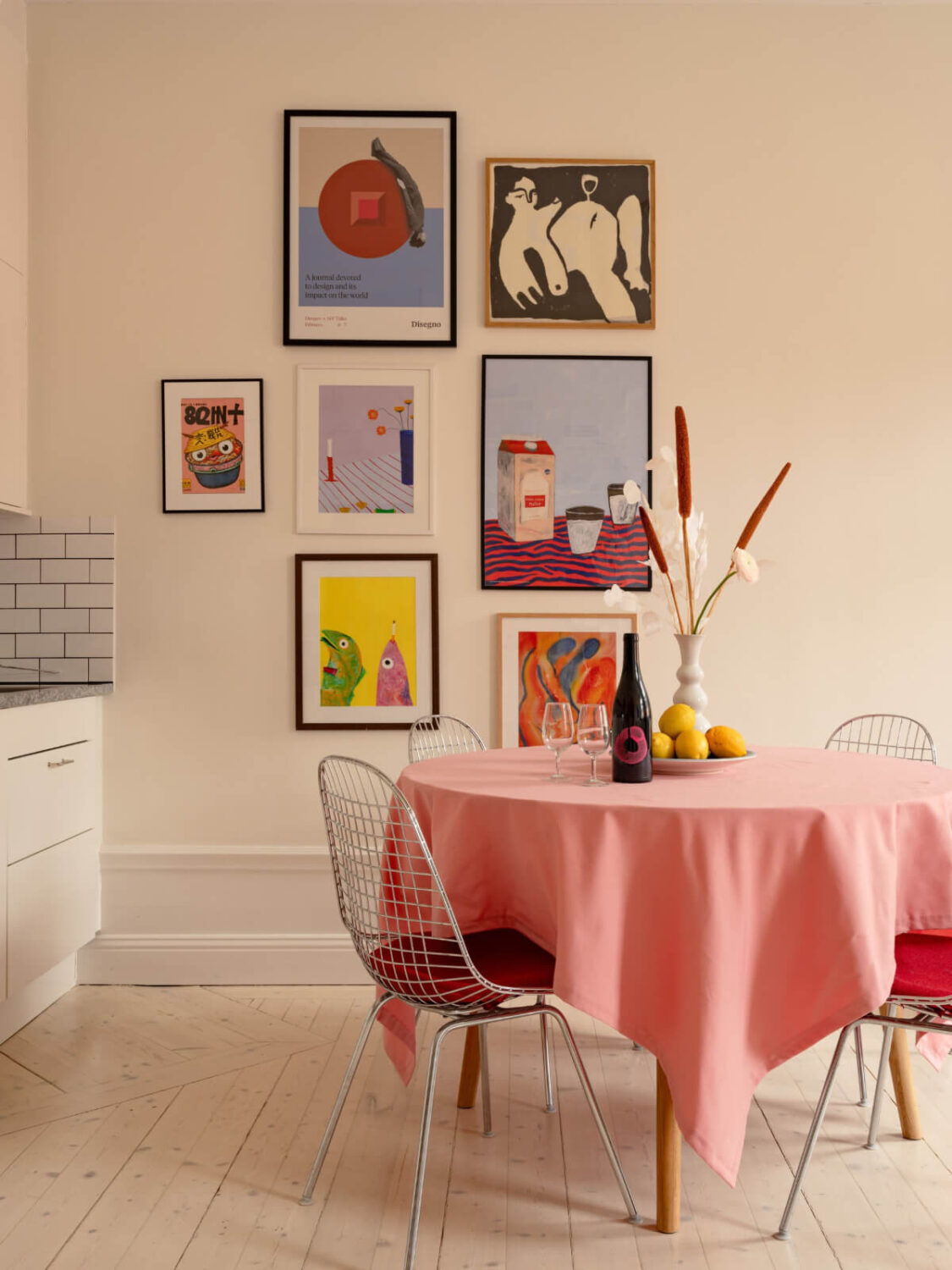 Cheerful Color Accents in a One-Bedroom Stockholm Apartment 5 colorful art round dining table
