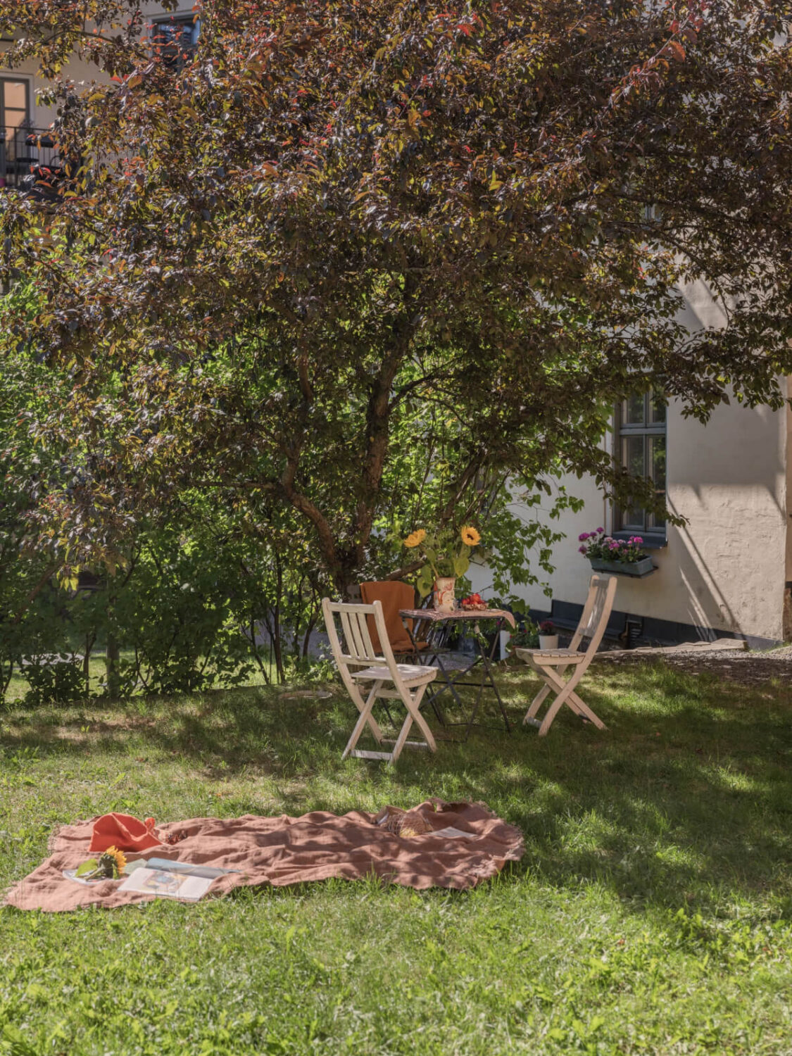 A Small Apartment with Rustic Floorboards and Beige Walls 22 communal garden