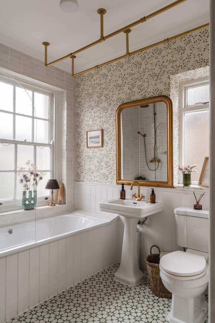 A Cozy Two-Bedroom Attic Apartment in a Victorian Townhouse 9 cottage style bathroom floral wallpaper brass fittings