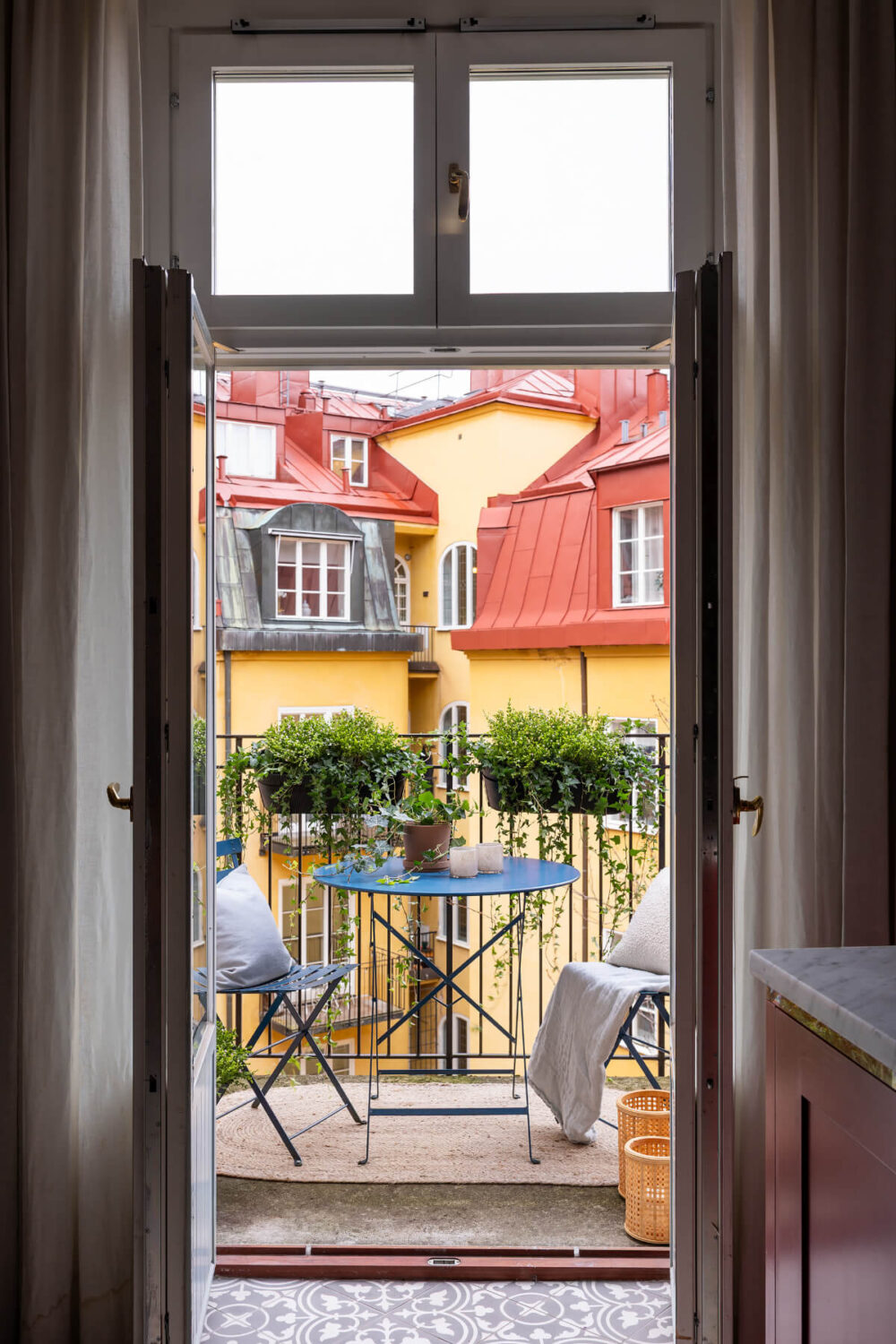 A Red Kitchen in a Grand Swedish Corner Apartment 15 courtyard balcony