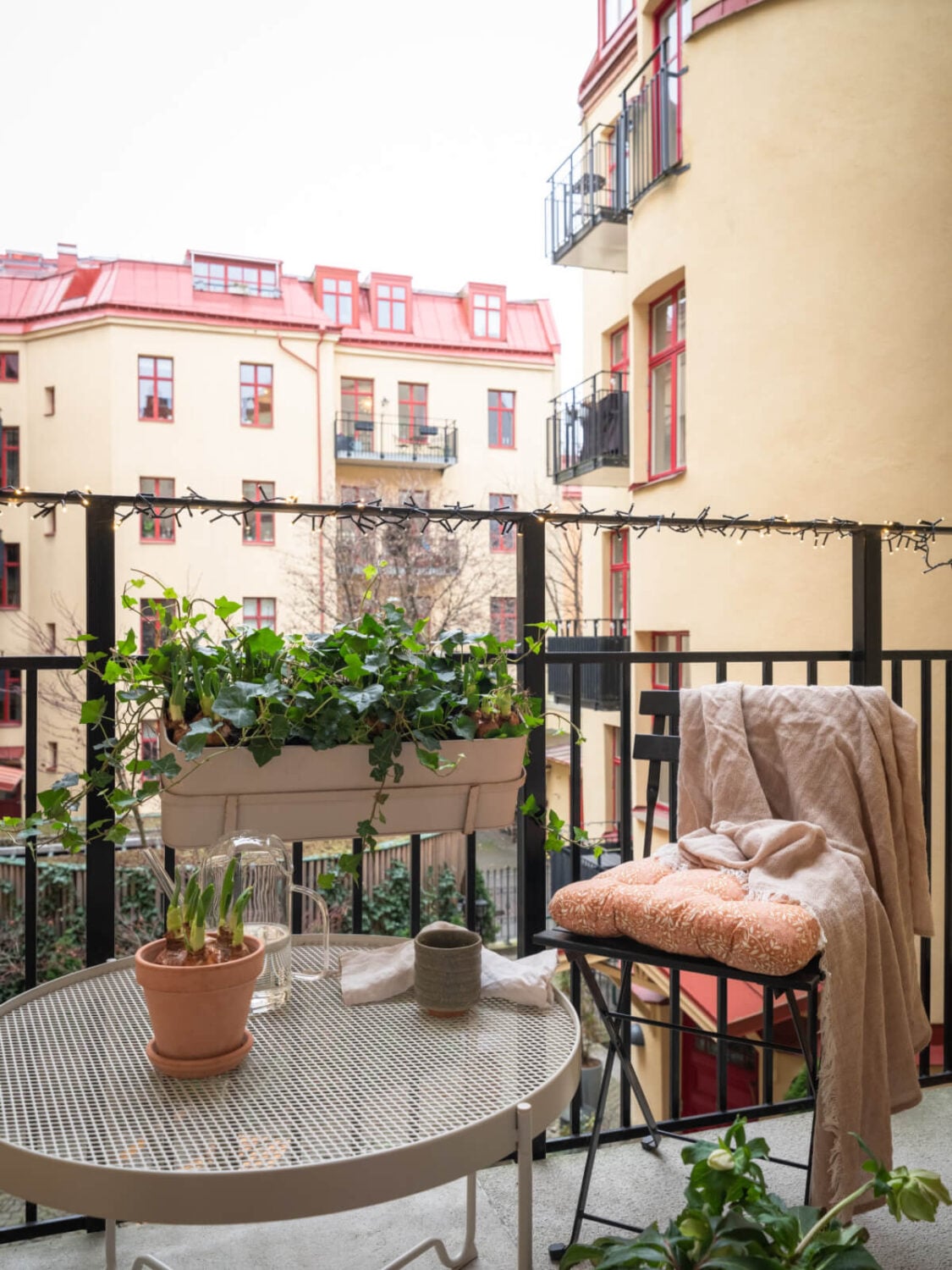 A Calm Color Palette in a Charming Swedish Apartment 11 courtyard balcony