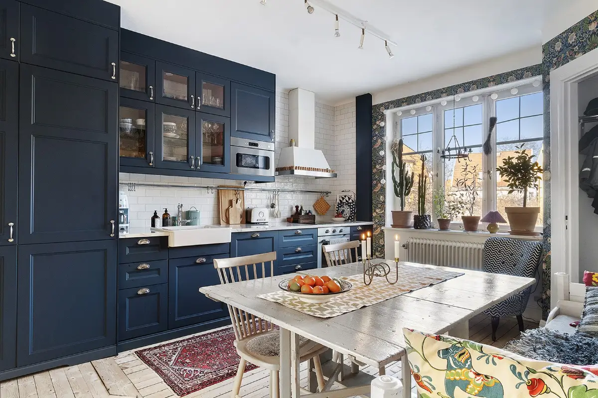A Charming Early 20th-Century Family Home in Sweden 4 dark blue kitchen butler sink