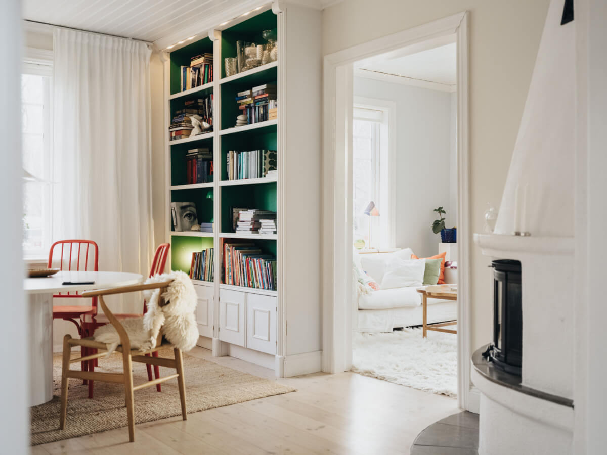 Light-Filled Rooms in a Charming 1907 Swedish Villa 13 dining room built-in bookshelves