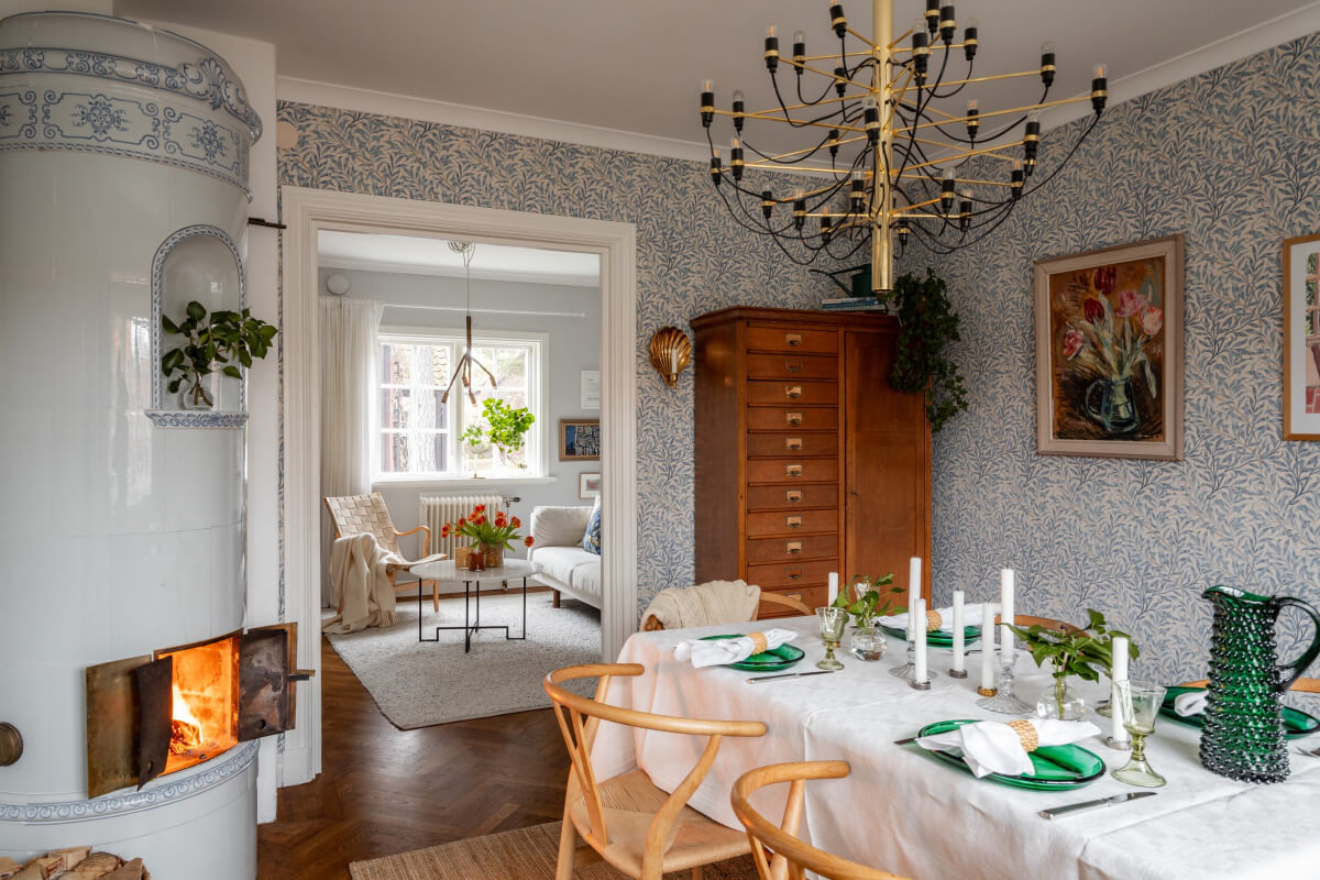 Turn-of-the-Century Charm Meets Modern Comfort in a Swedish House 8 dining room with fireplace