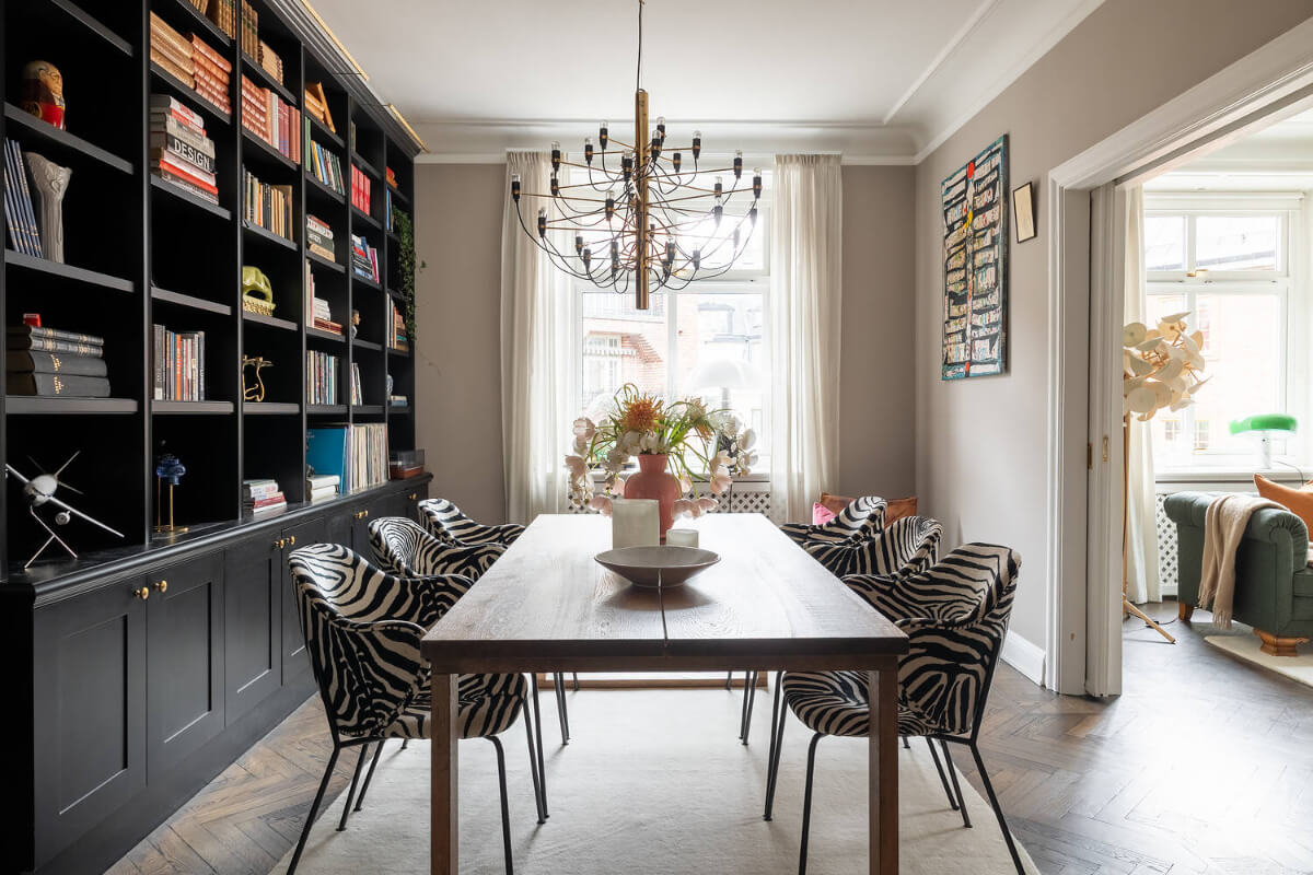 A Red Kitchen in a Grand Swedish Corner Apartment 4 dining room zebra chairs bookcases