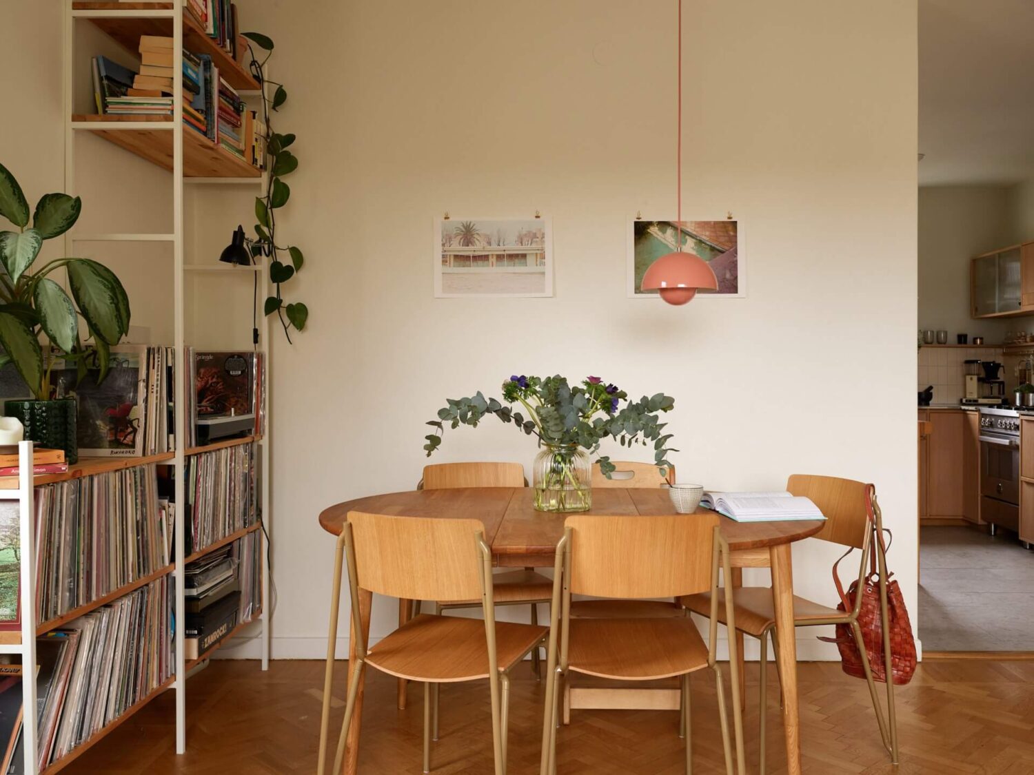 A Renovated 1940s Apartment with Colorful Bedrooms 5 dining table and shelving system