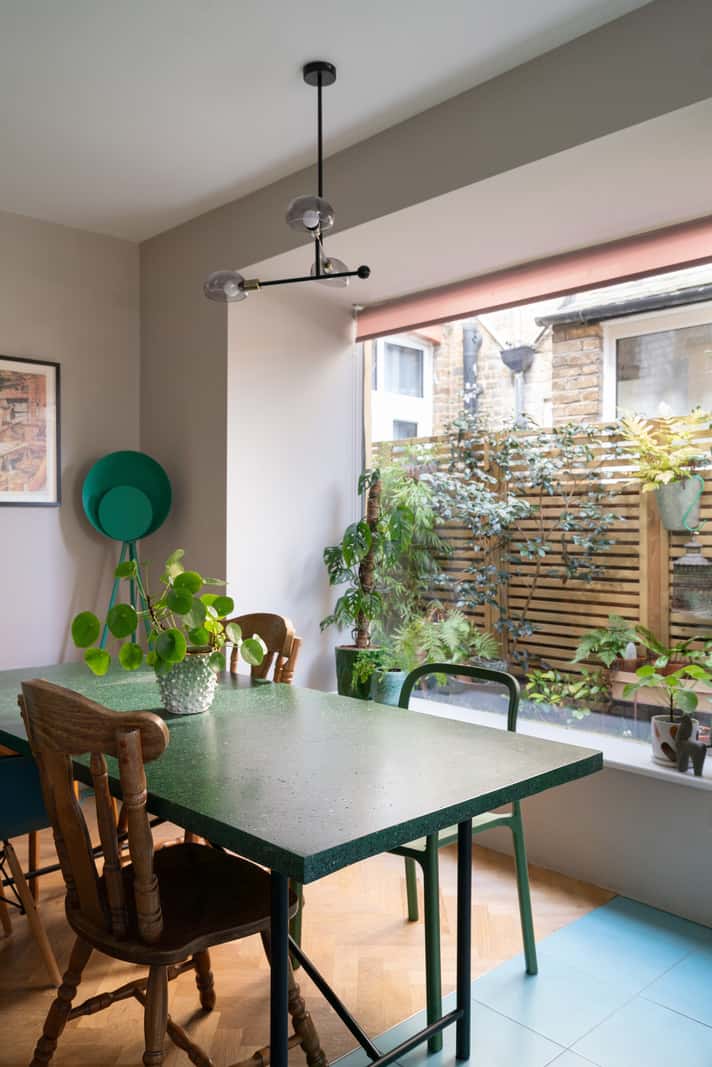 A Colorful Home with a Gold Extension in North London 7 dining table with large window