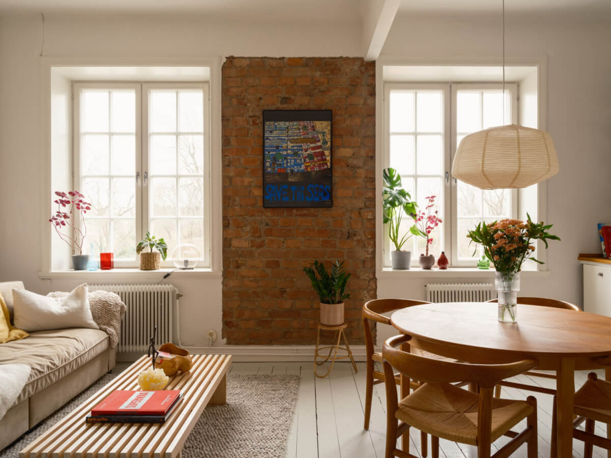 A Studio Apartment with an Exposed Brick Wall 2 exposed brick wall white floorboards