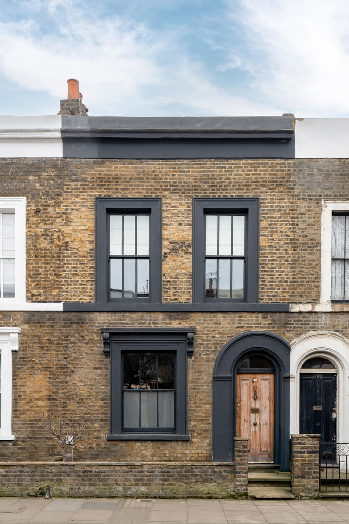 A Cozy Victorian Home Painted in Moody Blue and Gray Tones 33 exterior black brick london home A Cozy Victorian Home Painted in Moody Blue and Gray Tones