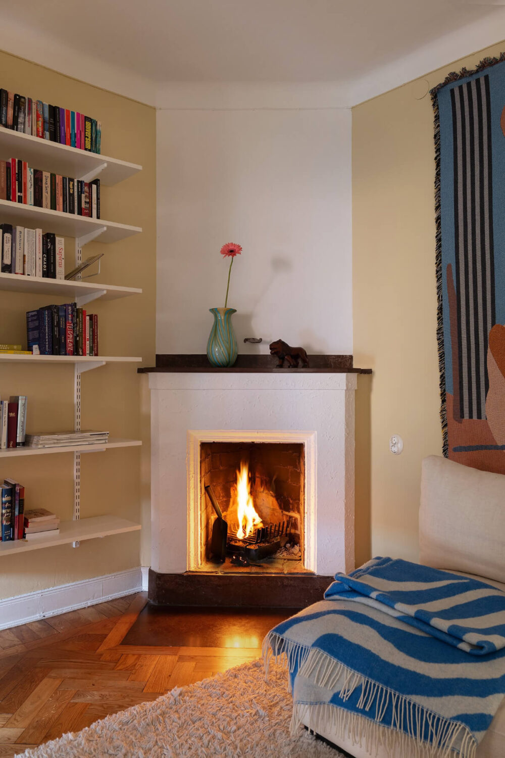 A Swedish Apartment with Period Features and Charming Color Pops 17 fireplace