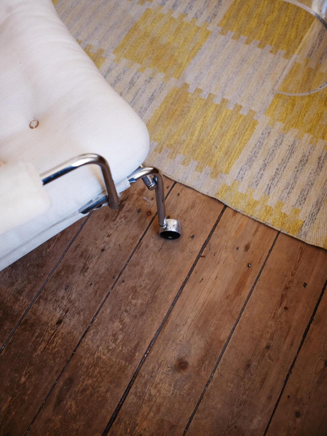A Small Apartment with Rustic Floorboards and Beige Walls 7 floor detail