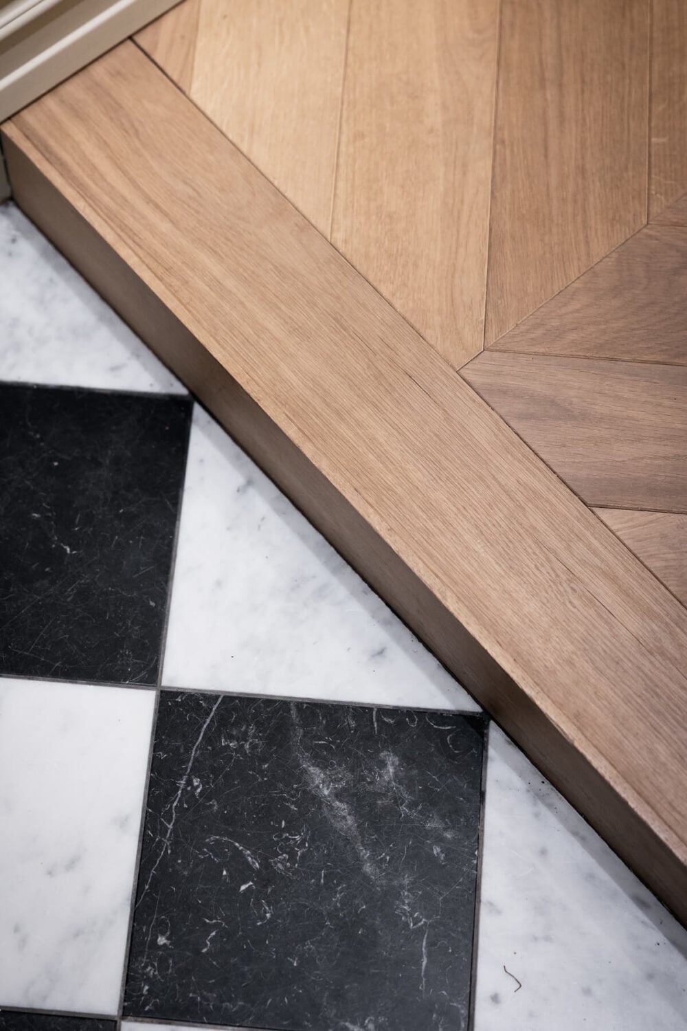 A Luxurious Stockholm Apartment with Period Features and a Blue Fireplace 25 floor detail checkerboard tiles and chevron parquet floor A Luxurious Stockholm Apartment with Period Features and a Blue Fireplace