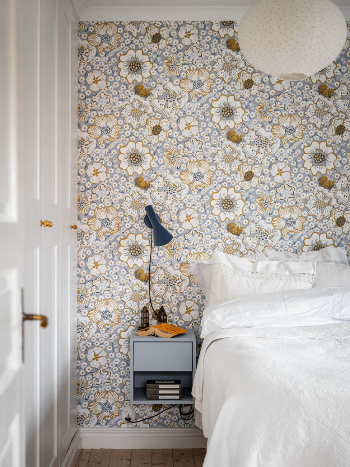 Turn-of-the-Century Charm Meets Modern Comfort in a Swedish House 21 floral wallpaper bedroom floating nightstand