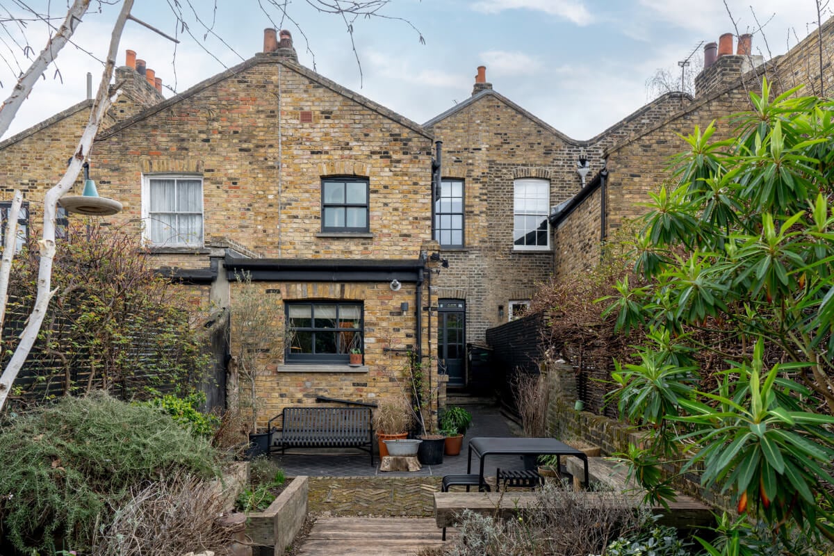 A Cozy Victorian Home Painted in Moody Blue and Gray Tones 34 garden london home