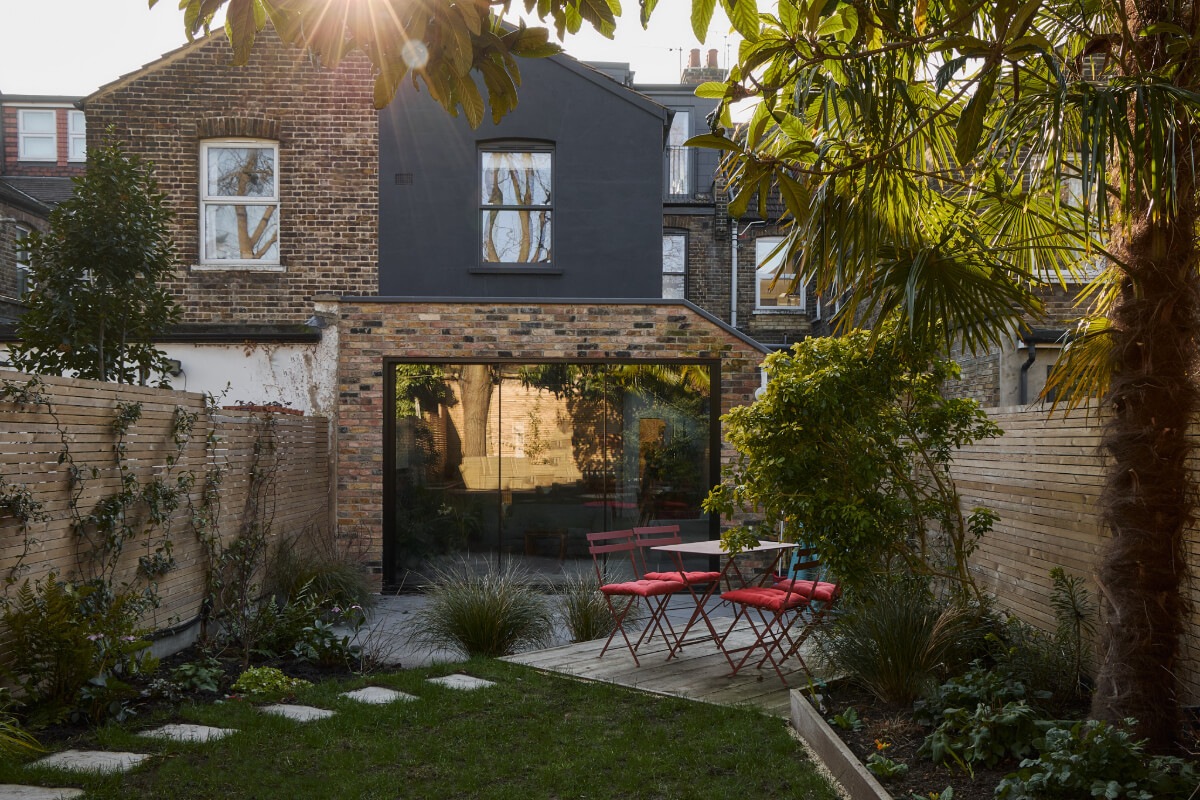 A Beautiful Extended Edwardian House Blends Period Features with Modern Design 32 garden wooden deck