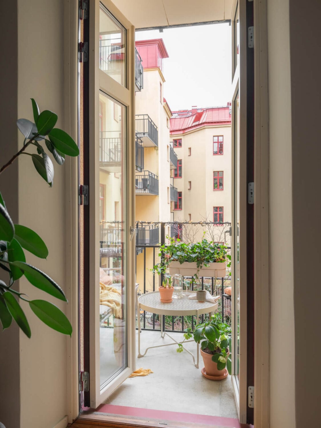 A Calm Color Palette in a Charming Swedish Apartment 10 glass balcony doors