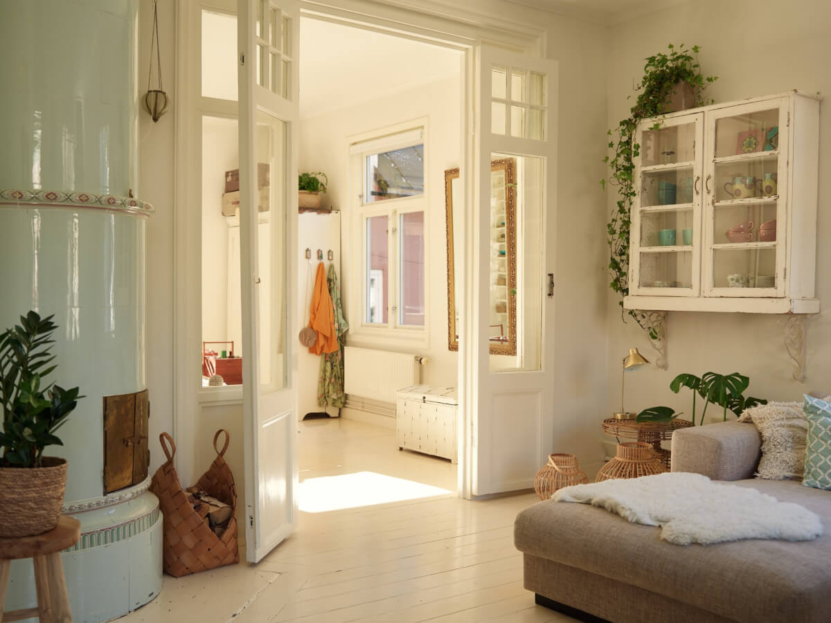 Light-Filled Rooms and a Charming Veranda in a Swedish Apartment 7 glass doors living room fireplace