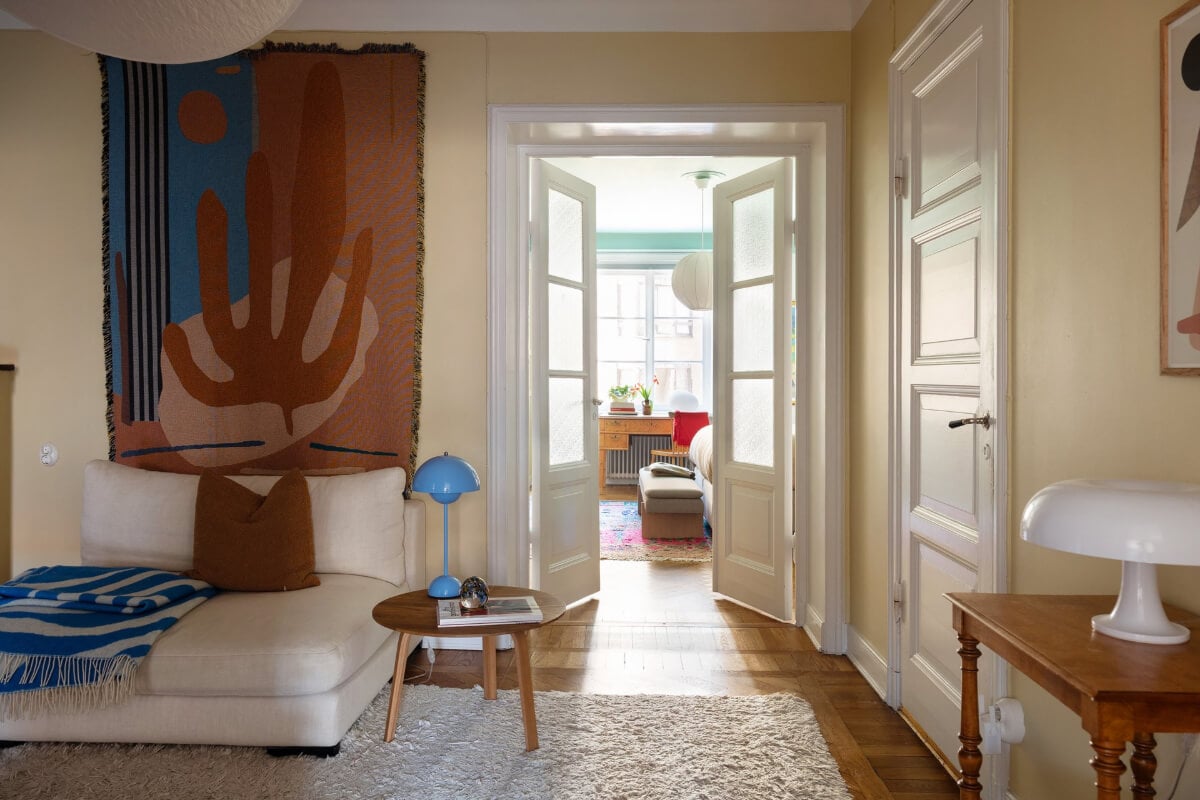 A Swedish Apartment with Period Features and Charming Color Pops 18 glass double doors