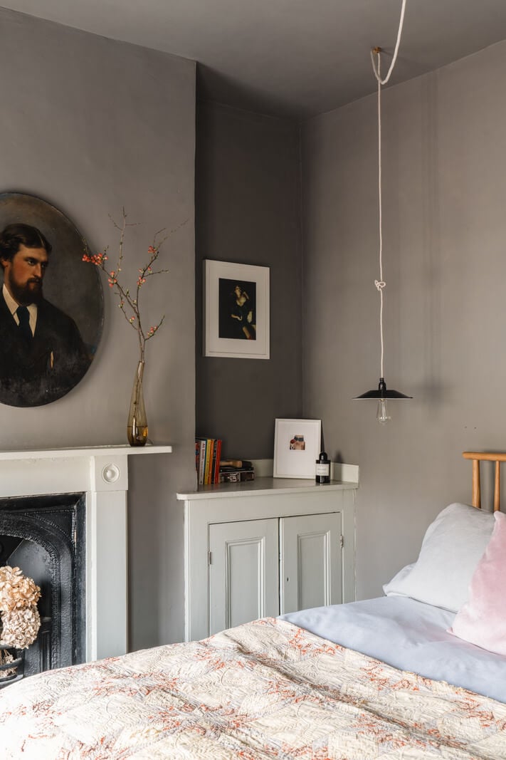 A Cozy Victorian Home Painted in Moody Blue and Gray Tones 18 gray bedroom antique art fireplace