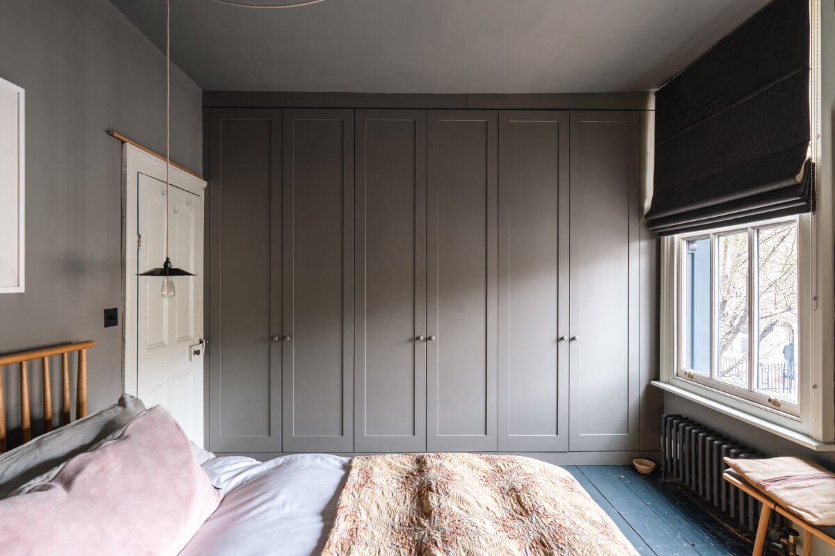 A Cozy Victorian Home Painted in Moody Blue and Gray Tones 19 gray bedroom built-in wardrobes